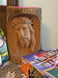 Carving of Jesus Christ in tree log