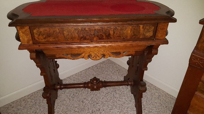 This table is interesting.  Looks like it should have been a sewing machine, but it has drawers.  Quite cool!