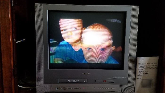 picture is perfect on the screen, my camera warped it! TV is fat, but has built in DVD and VHS player, how convenient! We also have a wall holder that will accommodate it!
