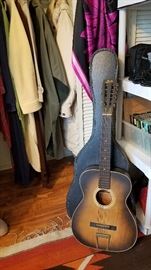 old guitar with case