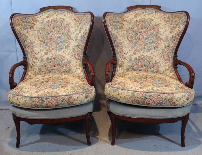 282a  Pair wingback parlor chairs with unusual shape and floral upholstery, ca. 1920, 42 in. T, 26 in. W, 23 in. D.