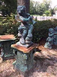 320a  Heavy cast iron set of 4 winged cupids on pedestal, 56 in .T including pedestal