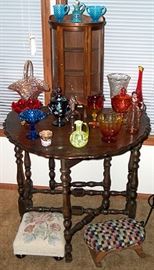 Drop leaf table, small china cabinet, colored glassware, foot stools
