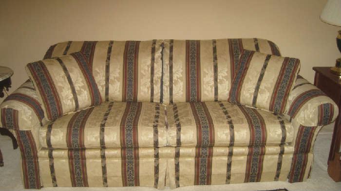 Upholstered Clayton Marcus sofa with pillows