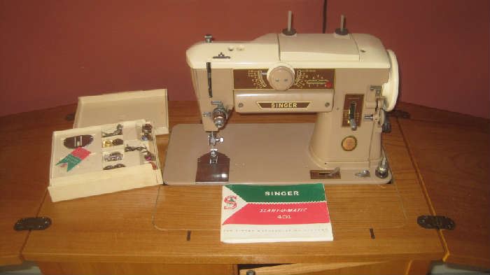 Singer Slant-o-Matic 401 sewing machine in cabinet