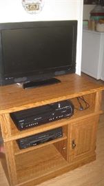 26" RCA television, Magnavox - DVD recorder, White Westinghouse- VCR, on wooden stand