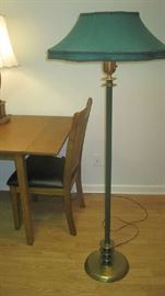 Tall floor lamp with brass base and wide shade