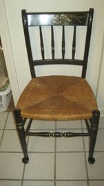 One of 5 black lacquer chairs