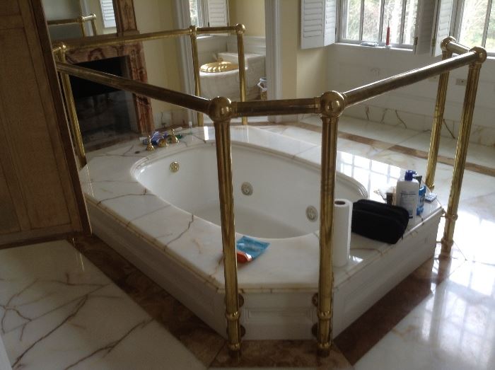 Jacuzzi tub with brass railing