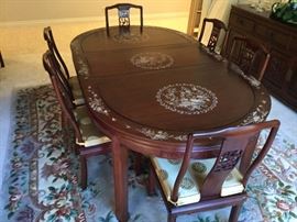 Rosewood Dining Table w/Pearl Inlay, measures 78" x 44" without the additional leaf which adds 18". Table has 8 chairs.