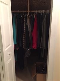 closets of beautiful clothes and coats