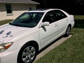 2002 Toyota Camry XLE 4-Door. Automatic. White with sliding sunroof. One owner (retired couple). No accidents. Maintenance records. 189,000 miles. Well kept. 