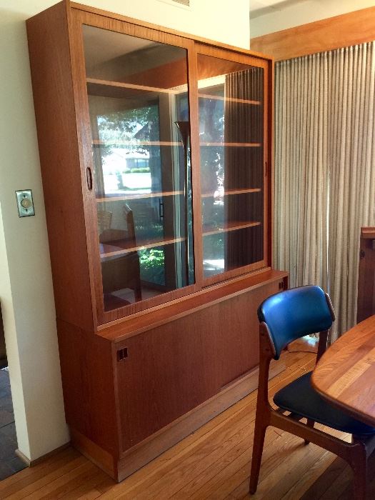 Wow! This piece is in aboslutely beautiful condition. Glass doors slide and drawers below