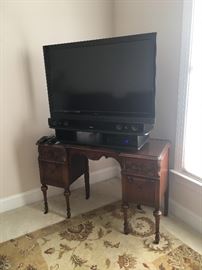 42" Vizio TV sitting on an adorable antique vanity (we have the mirror!)