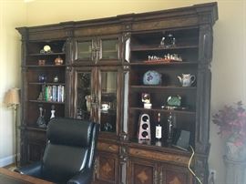 Absolutely gorgeous executive desk and office storage / display cabinet. Purchased 2 years ago from Furnitureland South for $7,000. 

Desk measures 36.5" deep by 30.5" tall by 74" wide. Storage on both sides.

Display cabinet measures  20.5" deep by 93" tall by 111" wide. Has shelving and a drawer on each section. Touch lighting for showcasing display items. 
