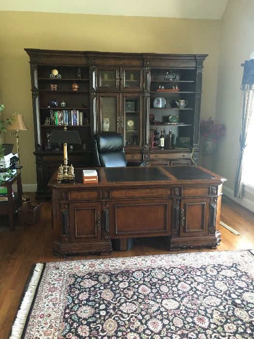 Absolutely gorgeous executive desk and office storage / display cabinet. Purchased 2 years ago from Furnitureland South for $7,000. 

Desk measures 36.5" deep by 30.5" tall by 74" wide. Storage on both sides.

Display cabinet measures  20.5" deep by 93" tall by 111" wide. Has shelving and a drawer on each section. Touch lighting for showcasing display items. 