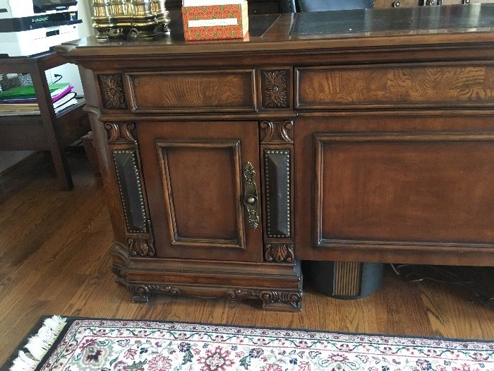 Absolutely gorgeous executive desk and office storage / display cabinet. Purchased 2 years ago from Furnitureland South for $7,000. 

Desk measures 36.5" deep by 30.5" tall by 74" wide. Storage on both sides.

Display cabinet measures  20.5" deep by 93" tall by 111" wide. Has shelving and a drawer on each section. Touch lighting for showcasing display items. 
