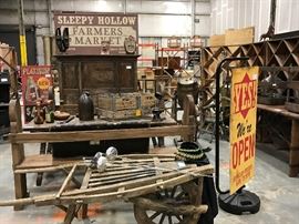 TO BE AUCTIONED 7.15.2017 Vintage Signs, Wine Racks, Wheelbarrow