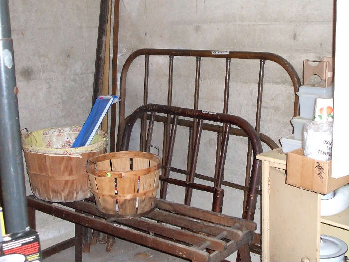Old iron bed and wash tub stand.
