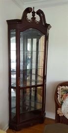 Pair of lighted corner display cabinets.