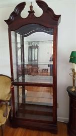 Tall lighted mirrored display cabinet