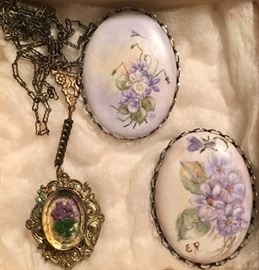 lucite locket and painted porcelain pins/brooches