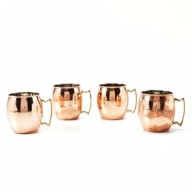 Old Dutch International Copper Plated Mugs: A set of Old Dutch International Copper plated mugs. This selection includes four rounded barrel-style mugs with a gold tone square metal handles. The base of each piece is marked “O.D.I. Made In HC”.