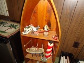 Another standing shelf unit in shape of a boat