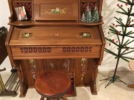 This 1920's vintage pump organ is a piece of art.  Check out the hand-painted floral motif -- a great piece of furniture even if you never played!