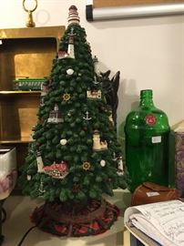 There are two of these lighthouse Christmas trees.  When plugged in, the lighthouses light up -- very nice.