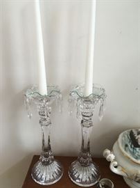 Two candlesticks with prisms.