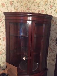 Curved glass front display cabinet