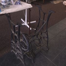 two old sewing machine tables (one has a granite top)