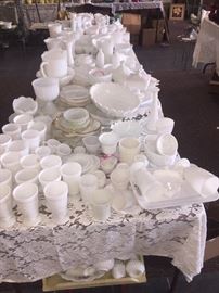 milk glass city PLUS there's another table filled with over 250 milk glass bud vases