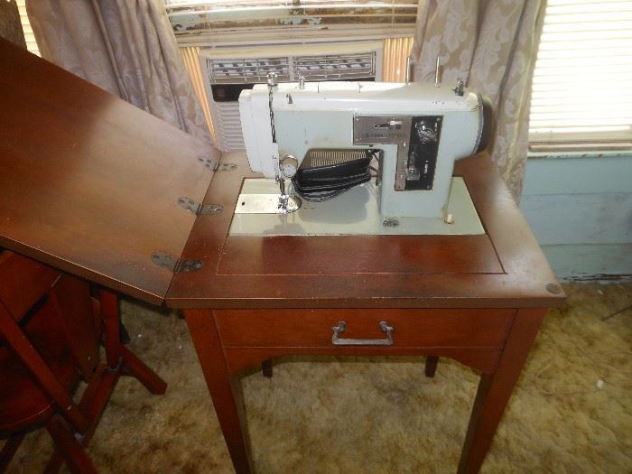 Sears electric sewing machine in cabinet/motor runs but presser foot does not move