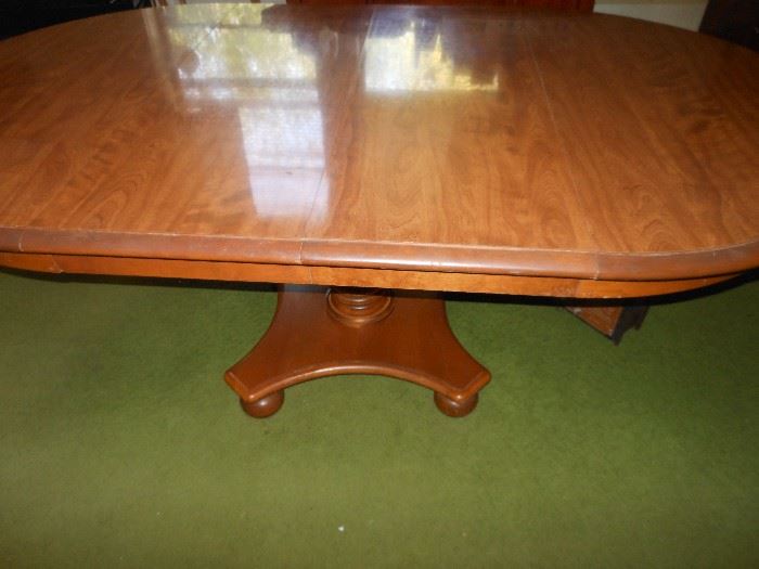 Oblong table/2 leaves shown/reduces to small round