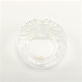 Lalique "Lion" Frosted Crystal Ashtray: A crystal ashtray by Lalique. This piece features the Lion pattern with a frosted lion head to one side. The underside is etched “Lalique® France”.