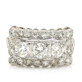 Platinum and Palladium 1.94 CTW Diamond Ring: A platinum and palladium 1.94 ctw diamond ring. This ring features three center round brilliant cut diamonds with a halo of single cut diamonds above a pierced scalloped gallery.