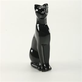 Baccarat Black Crystal Feline Figurine: A Baccarat black crystal feline figurine. The cat is posed in the style of the Egyptian goddess Bastet. The figurine is stamped with maker’s mark to its underside.