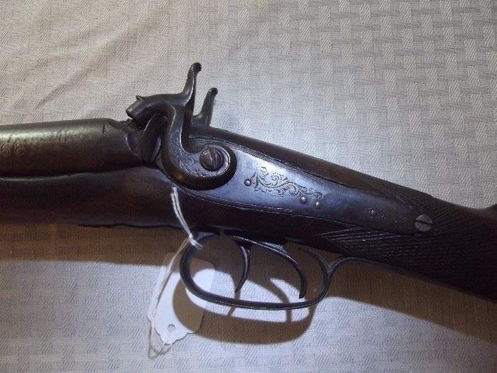 Note remaining engraving on left side of shotgun, dual hammers work smoothly. 