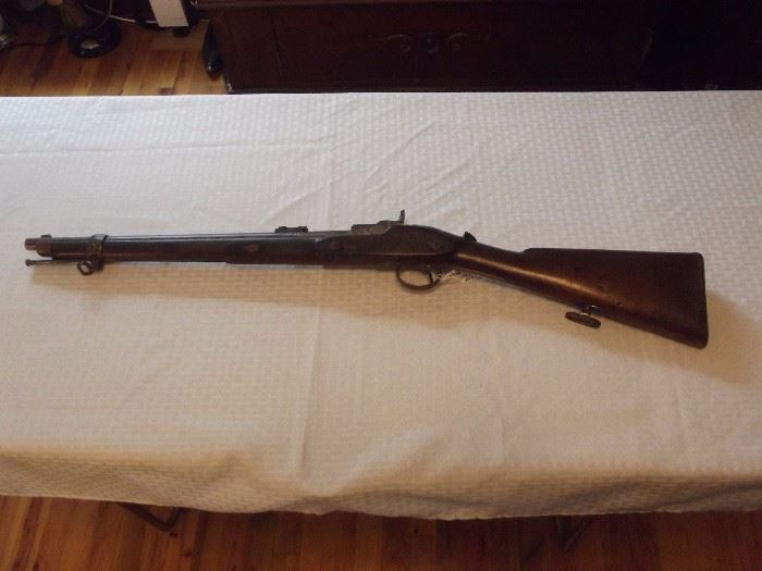 Left view of carbine rifle.