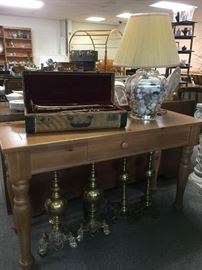 Sofa table, trumpet, lamp, andirons