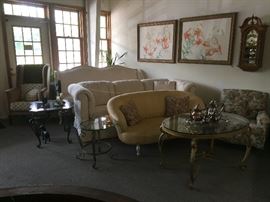 Sofas, loveseats, side tables with glass tops, upholstered chairs, door stops