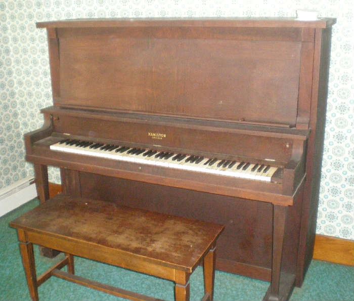 Upright piano and bench.