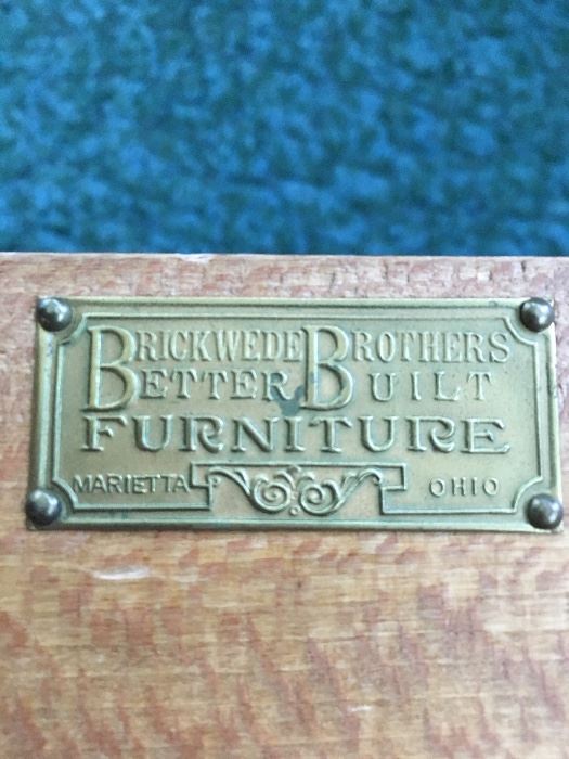 Metal tag on buffet, dining room furniture.