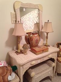 Wicker vanity, mirror, and bench; matching lamps; companion decorative vase and box