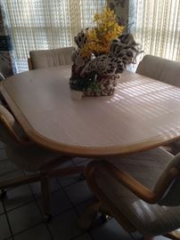 Oval breakfast table with 4 rolling arm chairs