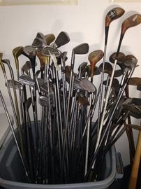 Assorted golf clubs