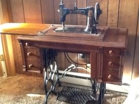 Treadle sewing machine, oak cabinet