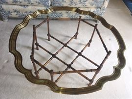 ROUND GLASS TOP COFFEE TABLE WITH BRASS, SCALLOPPED TRIM AND RATTAN BASE